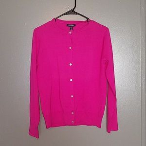 Pink button-up sweater.